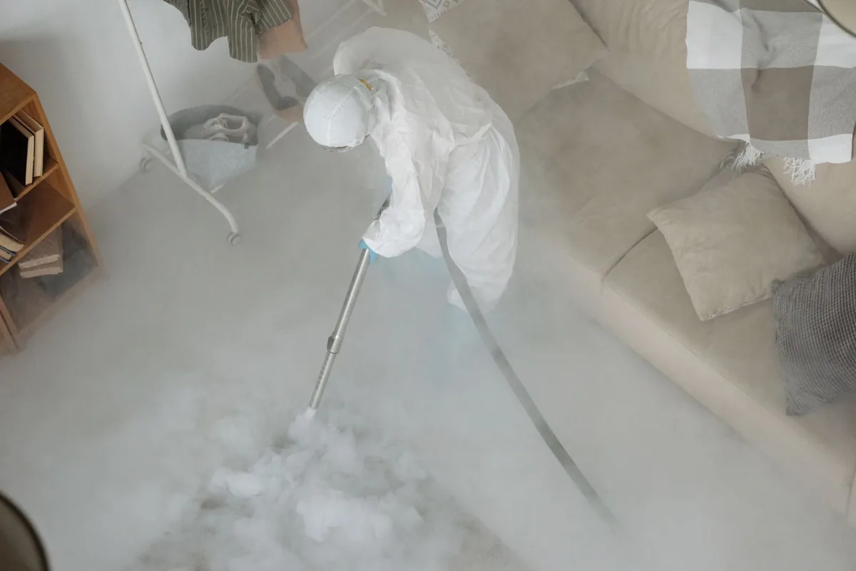 Biohazard cleanup technician in protective equipment, Newnan, GA